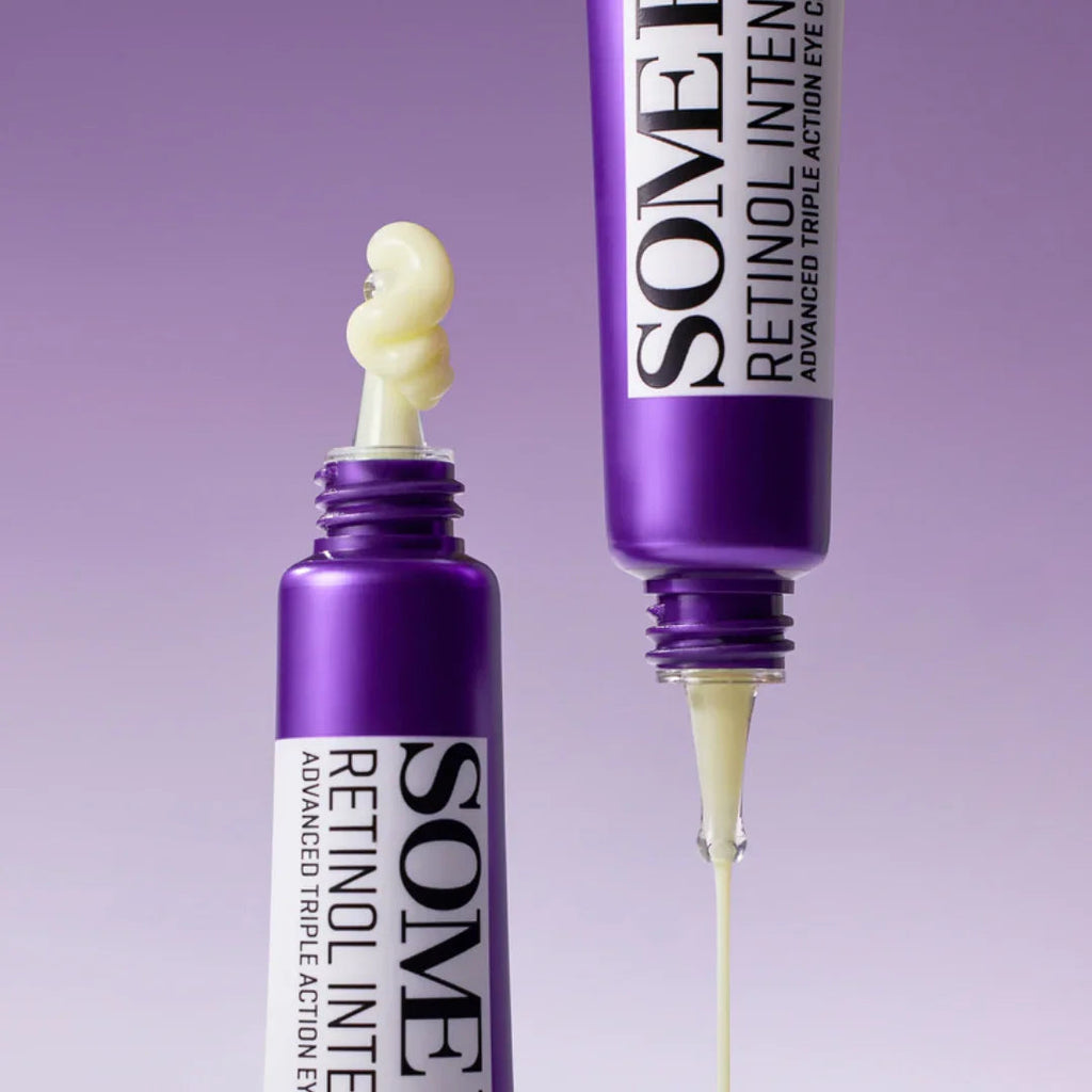 Purple tube of SOME BY MI Retinol Intense Advanced Triple Action Eye Cream with cream dispensing on purple background